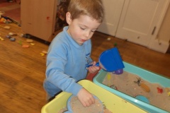 Children learning with sand trays at Ridgeway Playgroup